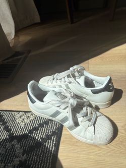 White and black  Adidas Superstars