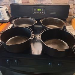 Vintage cast iron dutch ovens.