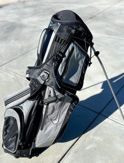 Nike Xtreme Sport Carry III Stand Bag. This model was released around 2010 and is a lightweight carry bag featuring a black and gray color scheme. 