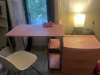 Pink desk with white chair and pink storage drawer