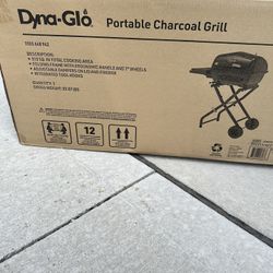 Brand New in box / Never used - Dyna-Glo Portable Charcoal Grill in Black  Make your next barbecue a movable feast with the Dyna-Glo Portable Charcoal