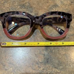Cheater glasses 1.50.  Pink half front turtle design on side. Never worn. Large size frames 