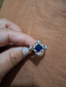 Dark Blue Stone With Little Diamonds Around It