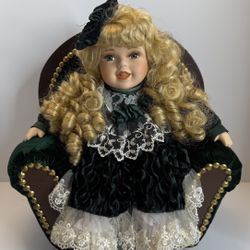 Vintage Porcelain Doll Blonde Curly Hair Green Velvet Dress on Chair Collectible
