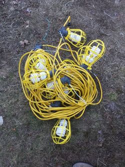 Temporary style hanging lights with protective cages