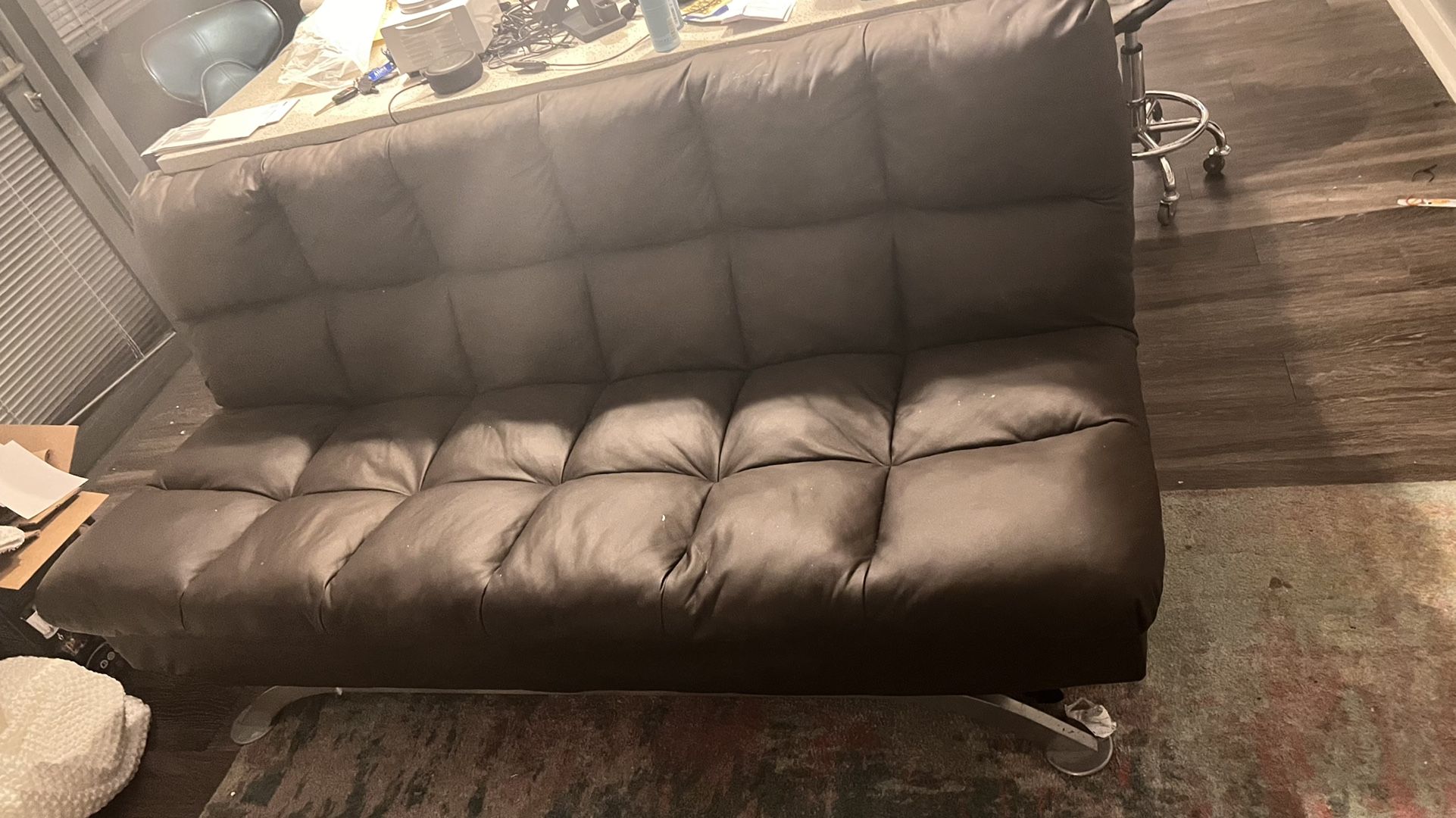 Brown leather couch/futon