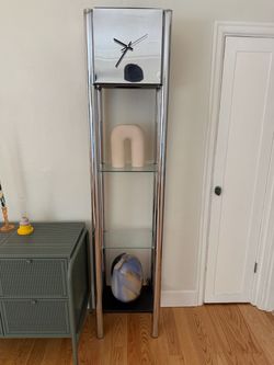 1970s modern chrome standing clock étagère features four tubular steel posts