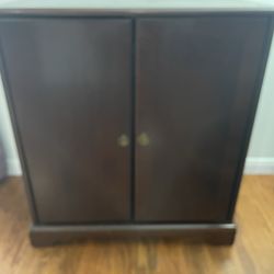 Cabinet With Pull Out Shelf Open In The Back Side.