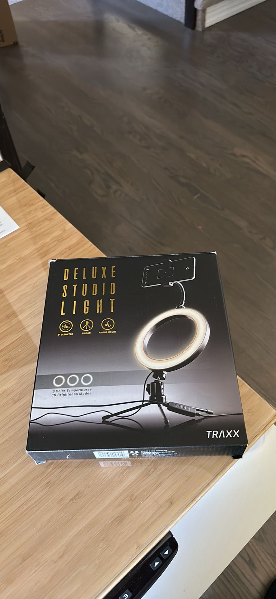 Studio light with detachable phone holder