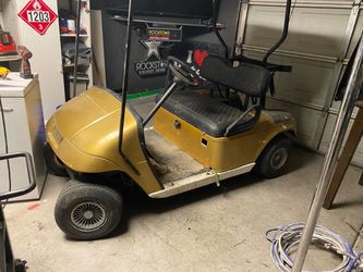 Gold Golf Cart with Black Seats