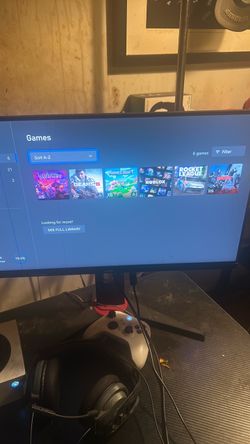 full gaming setup xbox, monitor, controller, and desk,