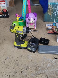 Ryobi impact drill set with charger and extra bits