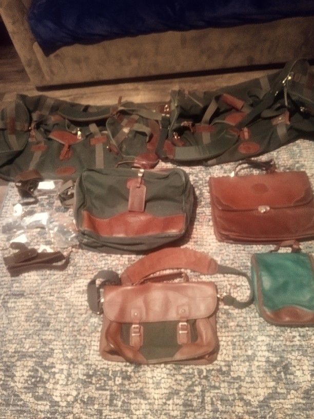 Vintage Set Of Orvis bags and briefcases along with brand new in plastic carrying straps