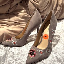  Bebe pumps. Embroidered heels. Size 7