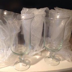 Four beautiful pedestal hurricane glass vases