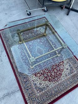 Coffee table.   - brass bottom, glass top