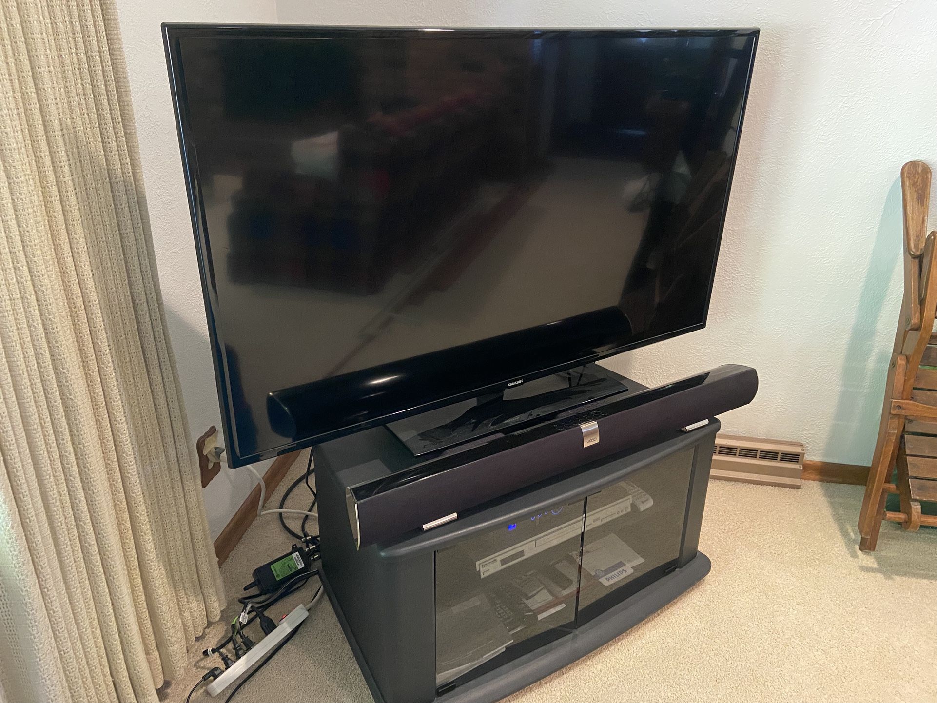 Samsung LED Tv, Vizio Soundbar, Panasonic DVD Player, Cabinet On Wheels