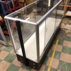 Glass Cabinet, 70”long, 20”deep,41” High, On Wheels