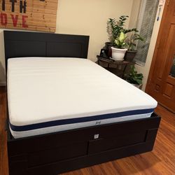 BRIMNES Bed frame with storage & headboard, black/Luröy, Queen