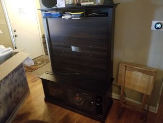 Great TV stand holds up to 50" With sliding glass doors