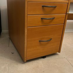 Free wood file cabinet.