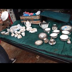 Japanese tea set with a geisha girl on the bottom this is a very rare set and very expensive 