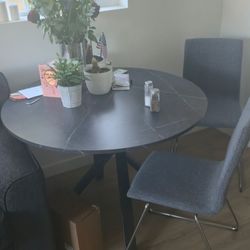 Round dining table with chairs