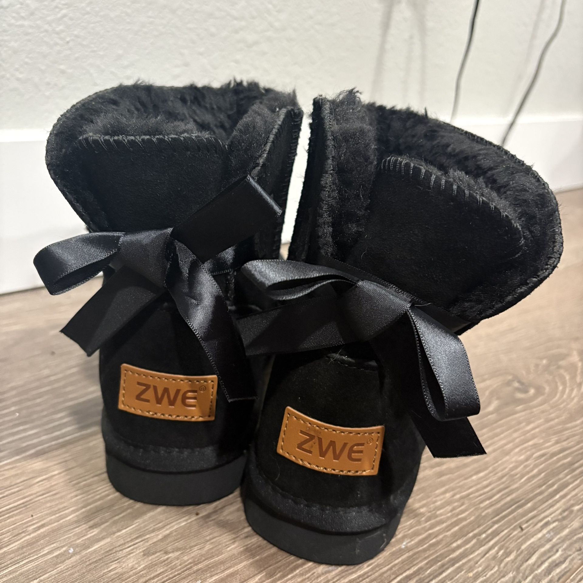 Black Boots With Bow On The Back
