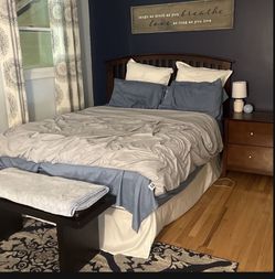 Bedframe, boxspring, and nightstand