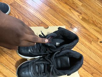 Air Jordan 11 Black High-Top Sneakers