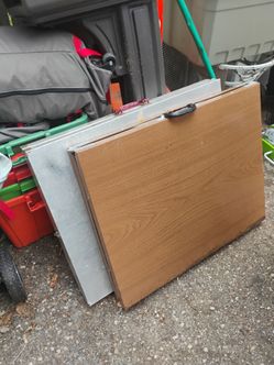 Two metal folding tables