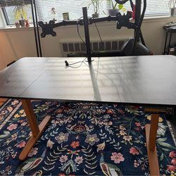 Electric Height Adjustable Standing Desk, 55x24 Inches with attached Dual Monitor Desk Mount.