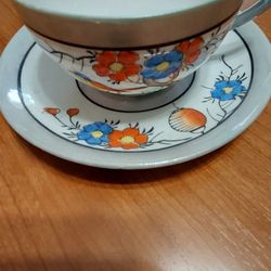 Tea Cup And Saucer. Small Cup And Tiny Vase