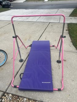 Gymnastics bar and mat