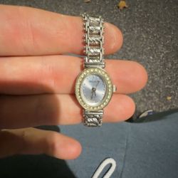 Gruen ladies' wristwatch, likely model GR7209, featuring a silver-tone finish and rhinestone-accented beze