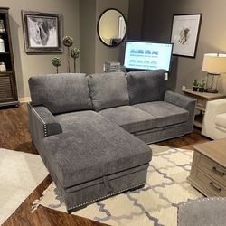 Sectional pull out bed with hidden storage chaise