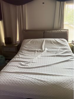 Grey queen sized adjustable bed