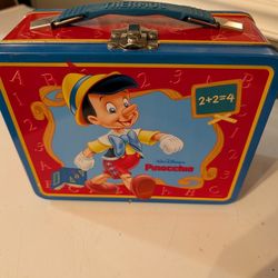 vintage Walt Disney's Pinocchio metal lunch box with a matching plastic thermos
