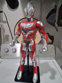 Large Ultraman  Geed Primitive  soft vinyl  model mounted on  a black display stand.  22 inches tall.  with sounds and lights.  good condition.