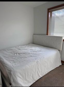 White queen bed with mattress