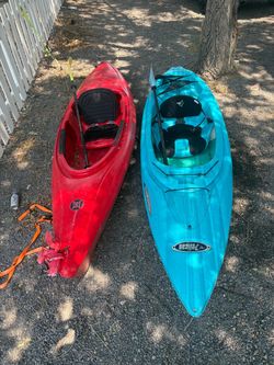 Two kayaks with paddles