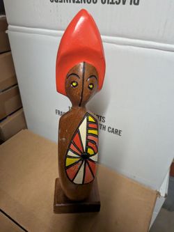 Wooden Figurine with Red Headpiece