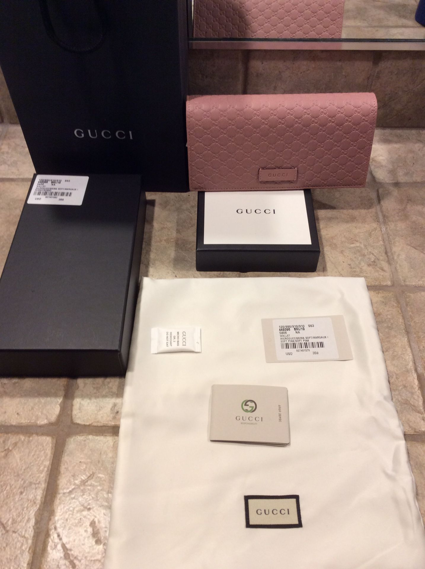 Brand new Gucci large wallet in soft pick leather. $350 Firm.