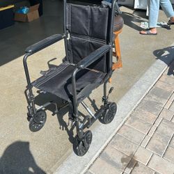  Compact Wheel Chair With Adjustable Foot Paddles