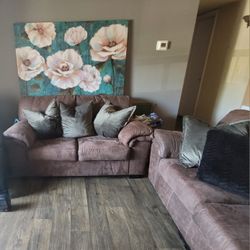 Cozy Living Room Set With Pillows & Wall Picture 