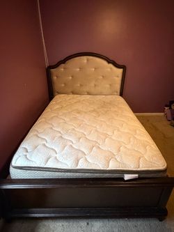 Dark wood storage bed