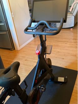 Excellent condition Peloton bike. Screen works perfectly and bike rides great. Includes Peloton mat, hand weights, upgraded comfort seat, charging cab
