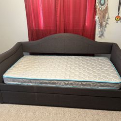 Twin Day bed With Trendal Underneath.