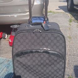 Large Checked Tumi Luggage