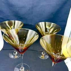 Set of 4 World Market (Pier 1) Martini Glasses.    Brand  New in Original Plastic container.   Amber Color